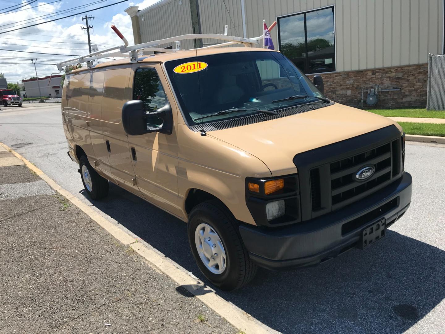 2011 Tan /Gray Ford E-Series Van E250 (1FTNE2EW5BD) with an 4.8 V8 engine, Automatic transmission, located at 577 Chester Pike, Prospect Park, PA, 19076, (610) 237-1015, 39.886154, -75.302338 - 2011 Ford E250 Cargo Van: Ladder racks, shelving, heavy duty partition, power inverter, fully metal body, FLEET MAINTAINED, runs LIKE NEW! This vehicle comes inspected and has been given a bumper to bumper safety check. It is very clean, reliable, and well maintained. We offer a unique pay plan t - Photo#3